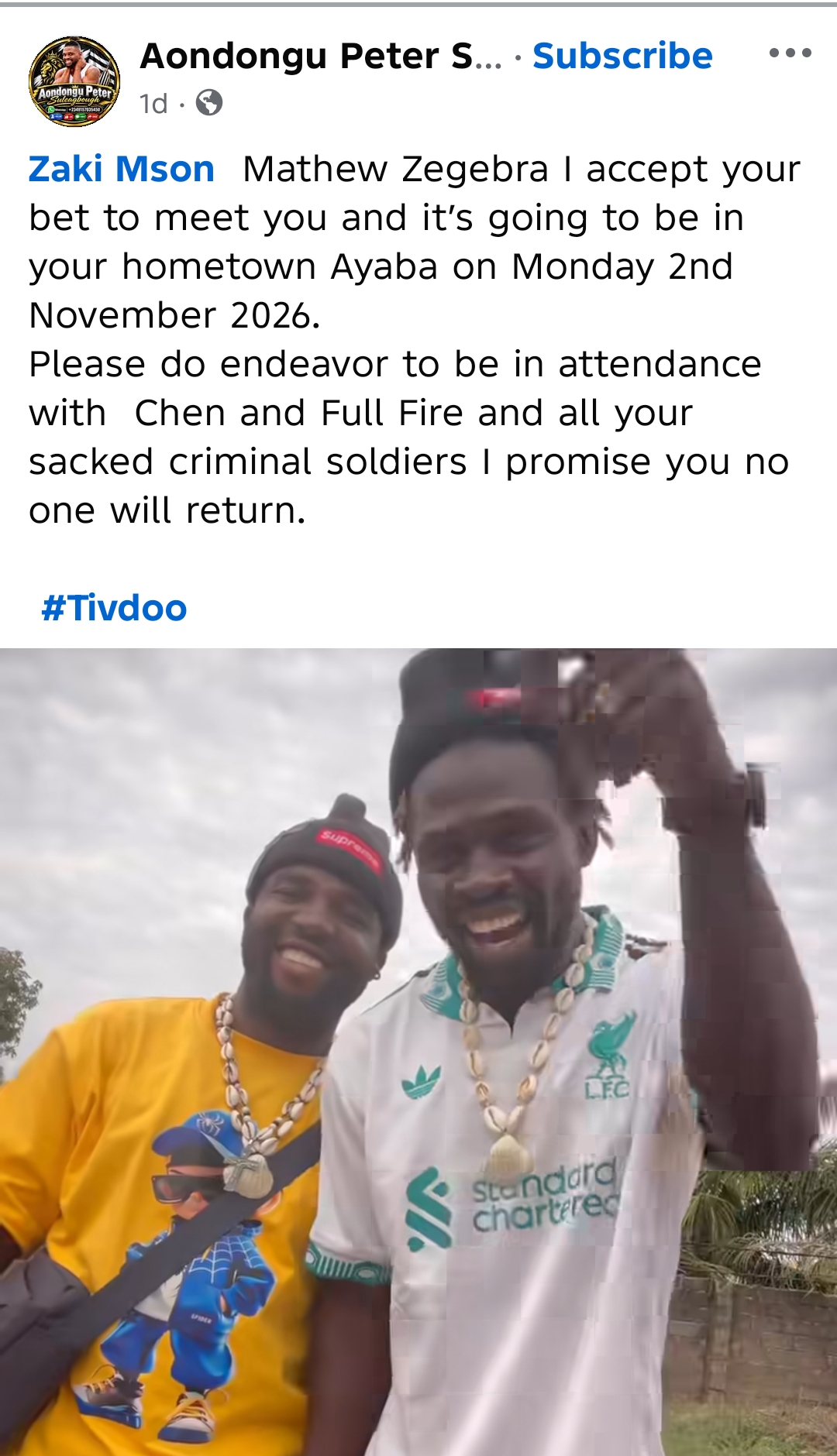 Screenshot of a Facebook post by Aondongu Peter Suleagbough accepting a challenge from Zaki Mson Matthew Zegebra, with a photo of two smiling men below the text.